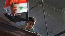 Damaek. Syrský chlapec s portrétem Baára Asada  (16. srpna 2018)