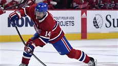 Tomáš Plekanec z Montrealu střílí na branku Detroitu ve svém 1000. duelu v NHL.