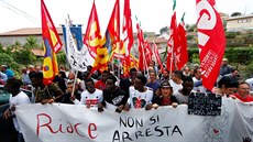 Migrants demonstrate in support of the mayor of the town Domenico Lucano in...