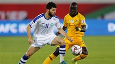 Momentka z utkání Austrálie (lutá) vs. Uzbekistán.