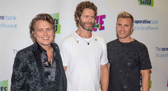 lenové souasné sestavy skupiny Take That. Zleva Mark Owen, Howard Donald a...