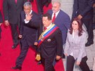 Bývalý prezident Venezuely Hugo Chávez v doprovodu Cílie Floresové, tehdejí...