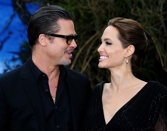 LONDON, ENGLAND - MAY 08:  Brad Pitt and Angelina Jolie attend a private reception as costumes and props from Disney's \"Maleficent\" are exhibited in support of Great Ormond Street Hospital at Kensington Palace on May 8, 2014 in London, England.  (Photo