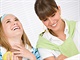 Student at home - two happy young woman with laptop