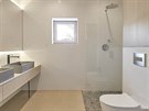 V koupeln byla pouita bílá keramická mozaika, betonová umyvadla Gravelli a...