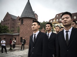  Huawei security guards line-up at the end of their workday at the new...