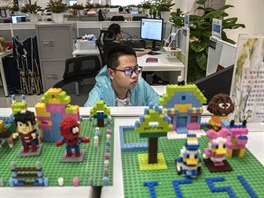  A worker in Huawei's  Cyber Security Lab works on his computer at the...