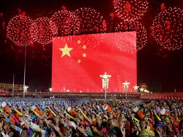 Fireworks explode over Tiananmen Square as performers take part in the evening...