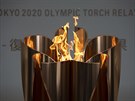 Olympijský ohe, který plápolá ve Fukuim.