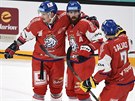etí hokejisté Andrej Nestrail, Filip Hronek a Jakub Galvas (zleva) se radují...