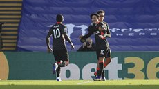 Takumi Minamino z Liverpoolu (. 18) se raduje z gólu proti Crystal Palace.