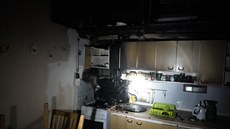 Plameny a kouř při požáru poničily jeden z bytů olomouckého domu s...