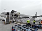 Boxes containing vaccines are unloaded from a Hungarian Airbus 330 cargo plane...