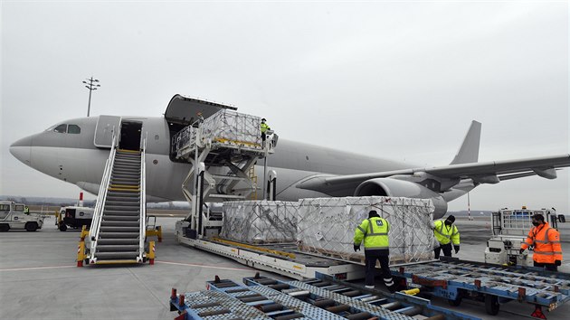 Boxes containing vaccines are unloaded from a Hungarian Airbus 330 cargo plane as the first batch of the vaccine against the new coronavirus produced by Sinopharm of China arrives at Budapest Liszt Ferenc International Airport in Budapest, Hungary, Tuesday, Feb. 16, 2021. The vaccine will not be used without its examination and approval by the National Public Health Center of Hungary. (Zoltan Mathe/MTI via AP)