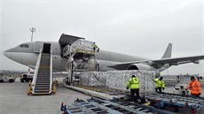 Boxes containing vaccines are unloaded from a Hungarian Airbus 330 cargo plane...