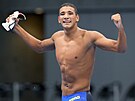 Tuniský plavec Ahmed Hafnáví se raduje z neekaného triumfu v olympijském...