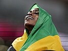 Jamajská sprinterka Elaine Thompsonová-Herahová se raduje z úspné obhajoby...