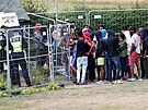 Migranti v litevském táboe pro uprchlíky. Do Litvy z Bloruska míí davy...