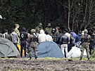 Migranti na hranici mezi Bloruskem a Polskem, které ve tvrtek vyhlásilo v...