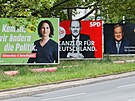 Election campaign billboards featuring the three top candidates for the German...