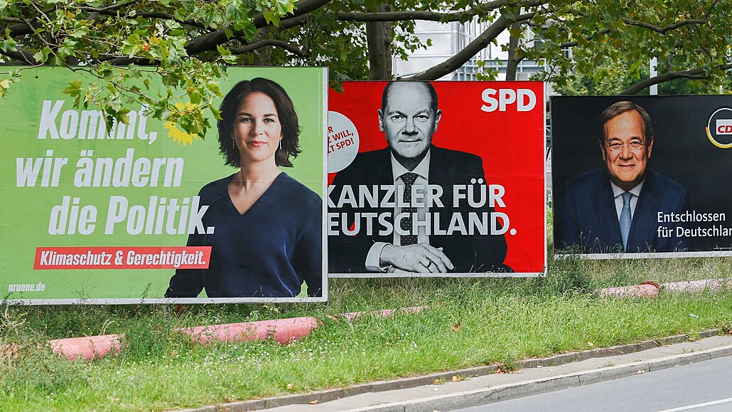 Election campaign billboards featuring the three top candidates for the German...