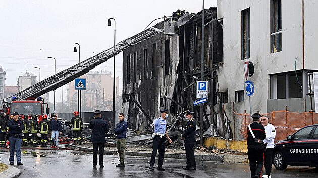 Emergency personnel works at the scene where a small plane crashed into a building in San Donato Milanese, Italy, October 3, 2021. REUTERS/Flavio Lo Scalzo