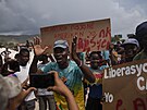 Po únosu skupiny misioná vypukly na Haiti protesty proti ádní gang a...