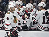 Seth Jones reaps congratulations on the goal from his teammates from Chicago.