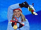 Úpln první zlatou medaili zimních olympijských her 2022 vybojovala bkyn...