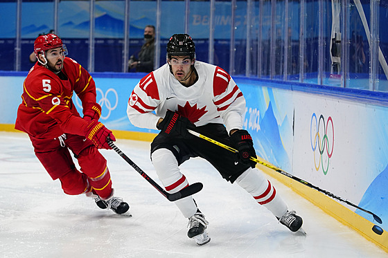 Olympijský turnaj v ledním hokeji. Zápas ína - Kanada. Kanaan Jack McBain....