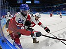 Olympijský turnaj mu v ledním hokeji. ech Michal epík (26) a výcar Romain...