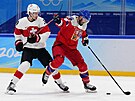 Olympijský turnaj mu v ledním hokeji. ech Michal epík (26) chytá hokejku...