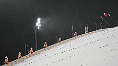 Danil Vassiljev z Kazachstánu v akci na ZOH v Pekingu 2022. (13. února 2022)