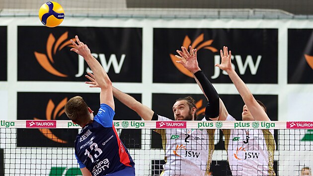 Jan Hadrava (left) and Yuri Gladyr try to block the attack of the Polish ...