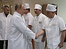 Ruský prezident Vladimir Putin v doprovodu ruského ministra obrany Sergeje...