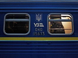 Territorial Defence member Antonina Romanova, 37, boards a train to the...