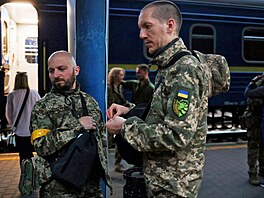 Territorial Defence members Oleksandr Zhygan, 37, and partner Antonina...