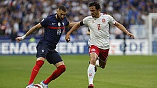 Francouzský útoník Karim Benzema a dánský záloník Thomas Delaney.