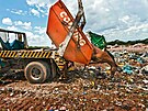 Garbage being prepared for compacting trash in sanitary landfill of the city of...
