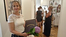 Magdalena Pujmanová, knihovnice eskolipského muzea a autorka výstavy vnované...