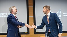 Premiér Petr Fiala (ODS) s ministrem vnitra Vítem Raku�anem (STAN) v rámci...