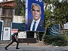 Pedvolební kampa je v Izraeli v plném proudu. Z plakátu v Tel Avivu shlíí...