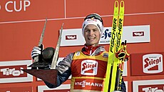 Sdru�ená� Johannes Lamparter slaví vít�zství v Seefeldu.