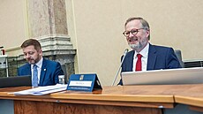 Premiér Petr Fiala a ministr vnitra Vít Rakušan na jednání vlády 25. ledna 2023
