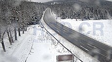 Zasněžená silnice I/9 u Svoru na Českolipsku. (27. března 2023)