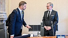 Premiér Petr Fiala a ministr vnitra Vít Rakušan na jednání vlády 10. května 2023