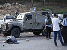 Následky útoku palestinských militant u osady Eli na okupovaném Západním behu...