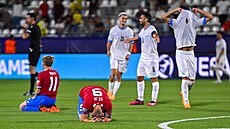 Smutní ei a fotbalisté Izraele slavící postup do tvrtfinále