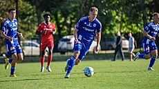 Olomoucký úto�ník Luká� Juli� v zápase s Tren�ínem.