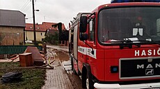 Na likvidaci následků velké vody v Třebomi na Opavsku se podíleli i dobrovolní...